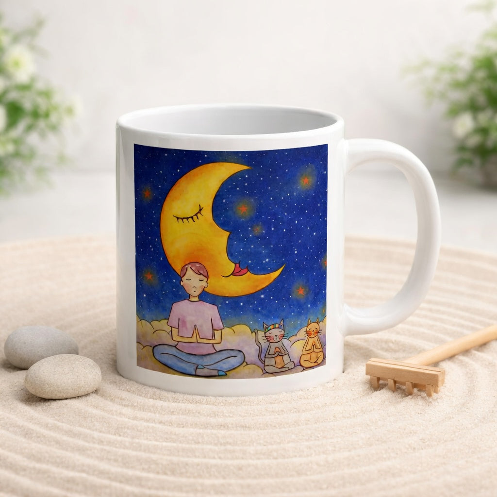 Man and his cats are meditating atop a cloud under the moon in a mindfulness poster.  The mug is in a beautifully raked zen garden with bushes and plants behind it.