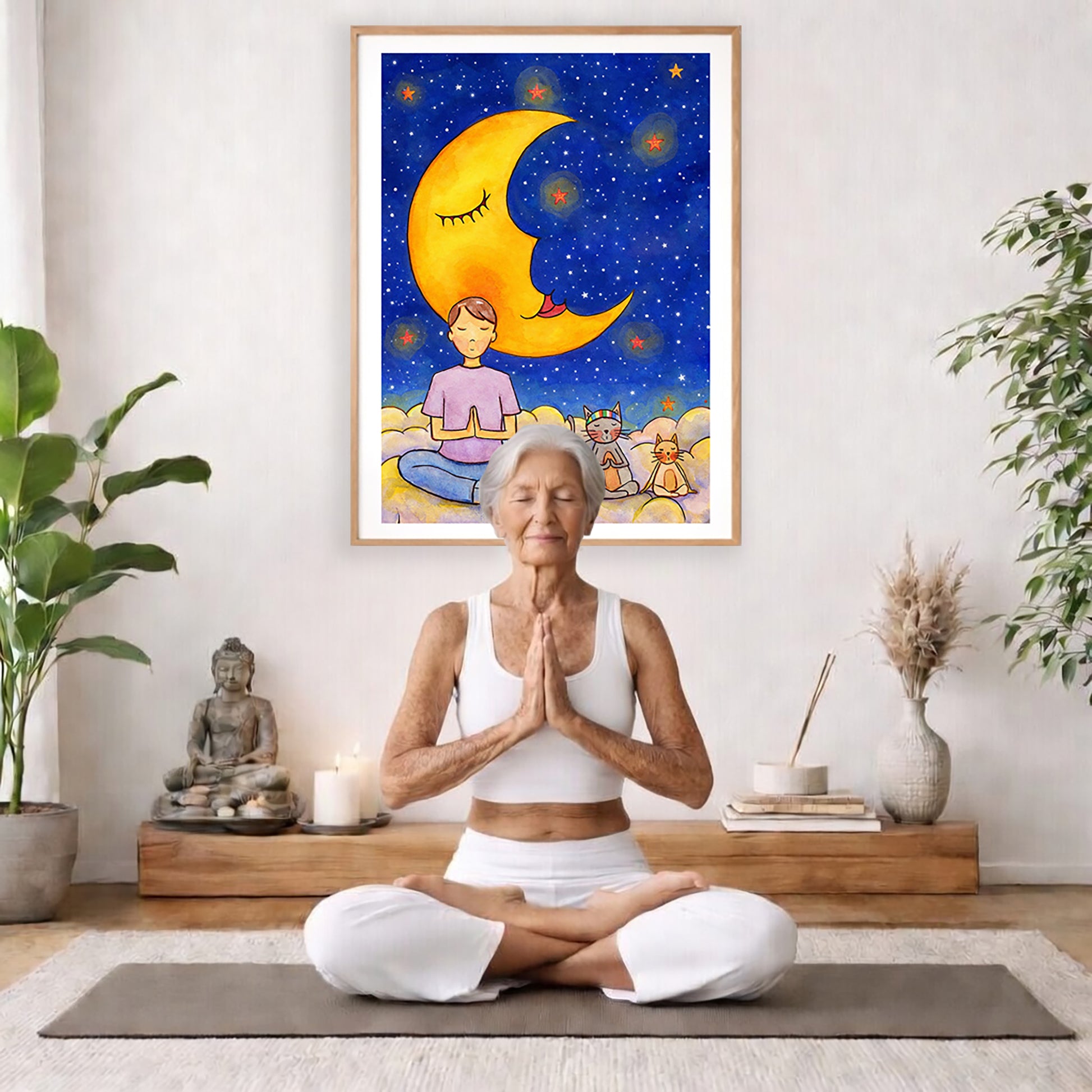 Man with cats meditating under the moonlight on mindfulness poster.  The poster is framed and is in the center of the living room wall. There is a woman meditating facing away from the wall. Behind her is a coffee table with incense and a Buddha statue. There are potted plants on the right and left side of the background.
