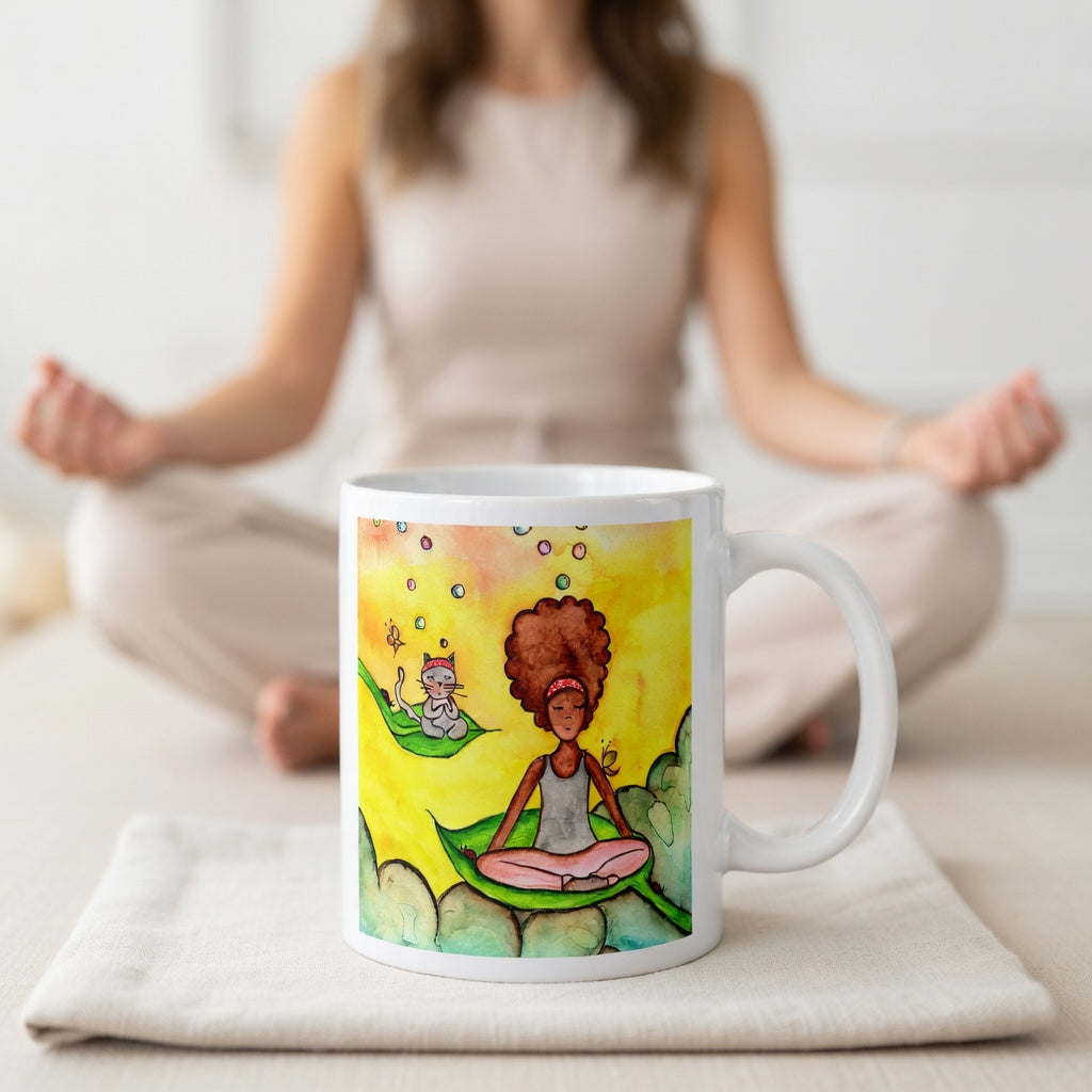 Woman and cat sitting peacefully on leaves in meditation, nature-inspired mindfulness scene representing calm, balance and connection, printed on a spiritual coffee mug.  The mug is sitting on a white cloth. A woman is meditating in the background.
