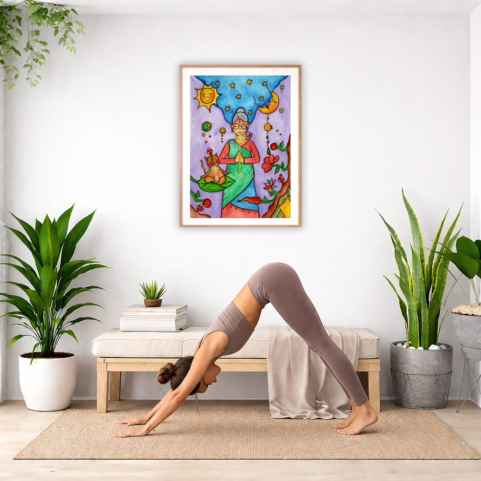 Poster of a woman's throat chakra energy glowing. The poster is framed and is in the center of the living room wall. Below the poster a woman is doing the yoga posture downward facing dog on a yoga mat.