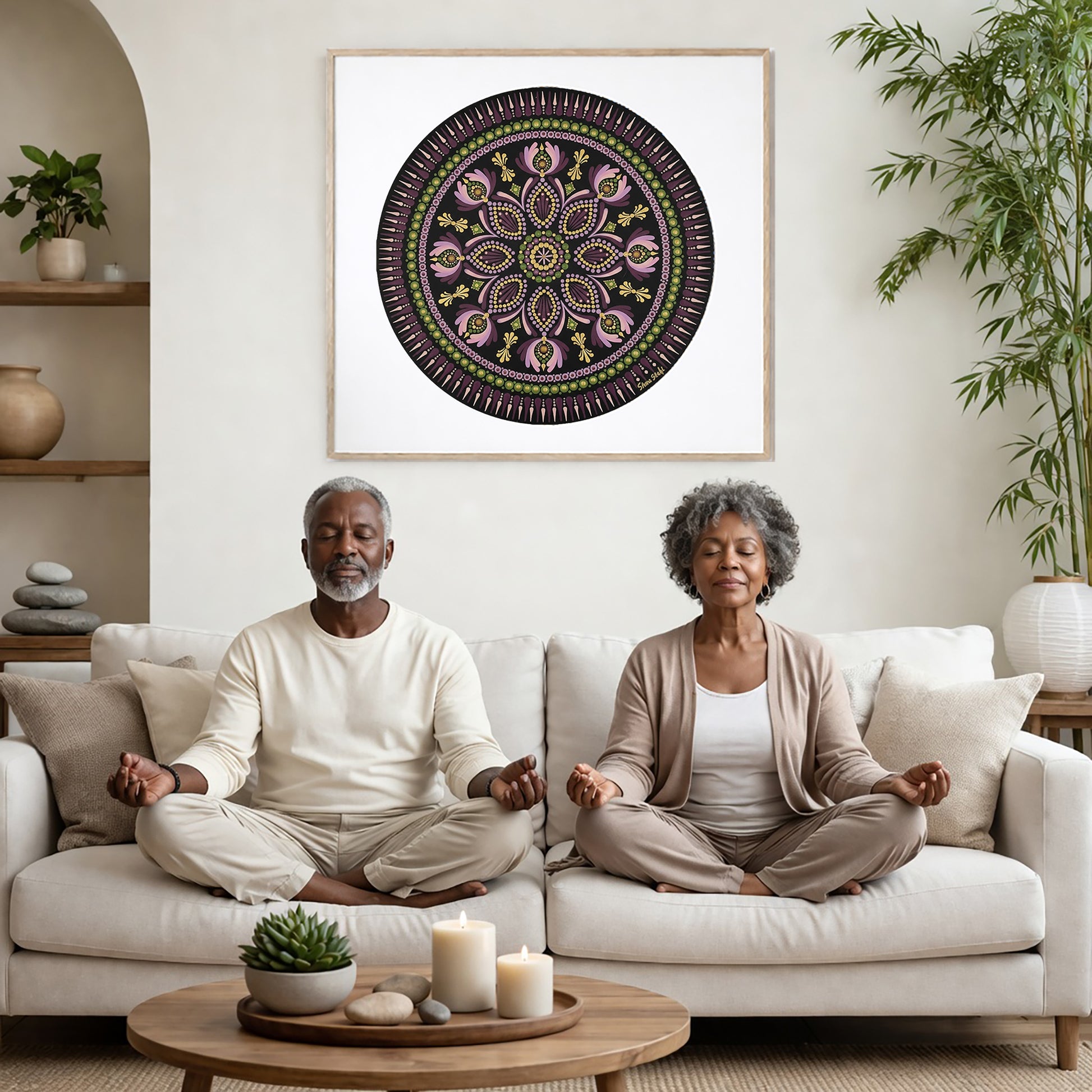 Mandala with bold magenta outer rim and intricate geometric layers, vibrant meditation design on a poster.  A couple is meditating on their couch. The mandala is framed on a wall behind them. There is a coffee table in front with candles burning and a potted plant. There is a potted plant to the right and shelves on the left.

