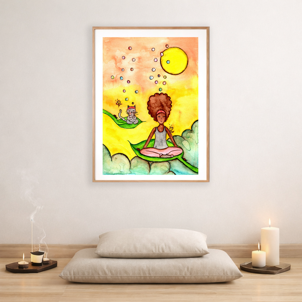 Poster of a woman and a cat meditating on a leaf with a yellow sunny background.   The poster is framed and is in the center of the living room wall. Below the poster is are two pillows on a hardwood floor. To the bottom left there is incense and candles on a tray. To the right there are two candles burning.
