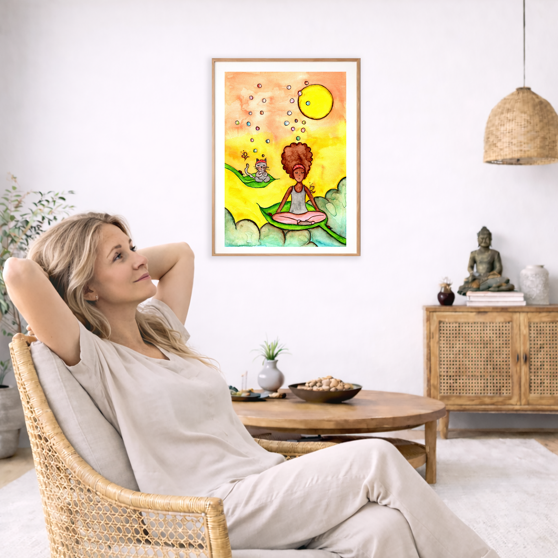 Poster of a woman and a cat meditating on a leaf with a yellow sunny background.   The poster is framed and is in the center of the living room wall. To the left a woman is relaxing in her chair with her hands behind her head. There is a small coffee table beside her with a bowl of walnuts, incense and a small green plant. On the right side of the room is a cabinet with a Buddha statue, books and an urn on it. To the left is a green floor plant.