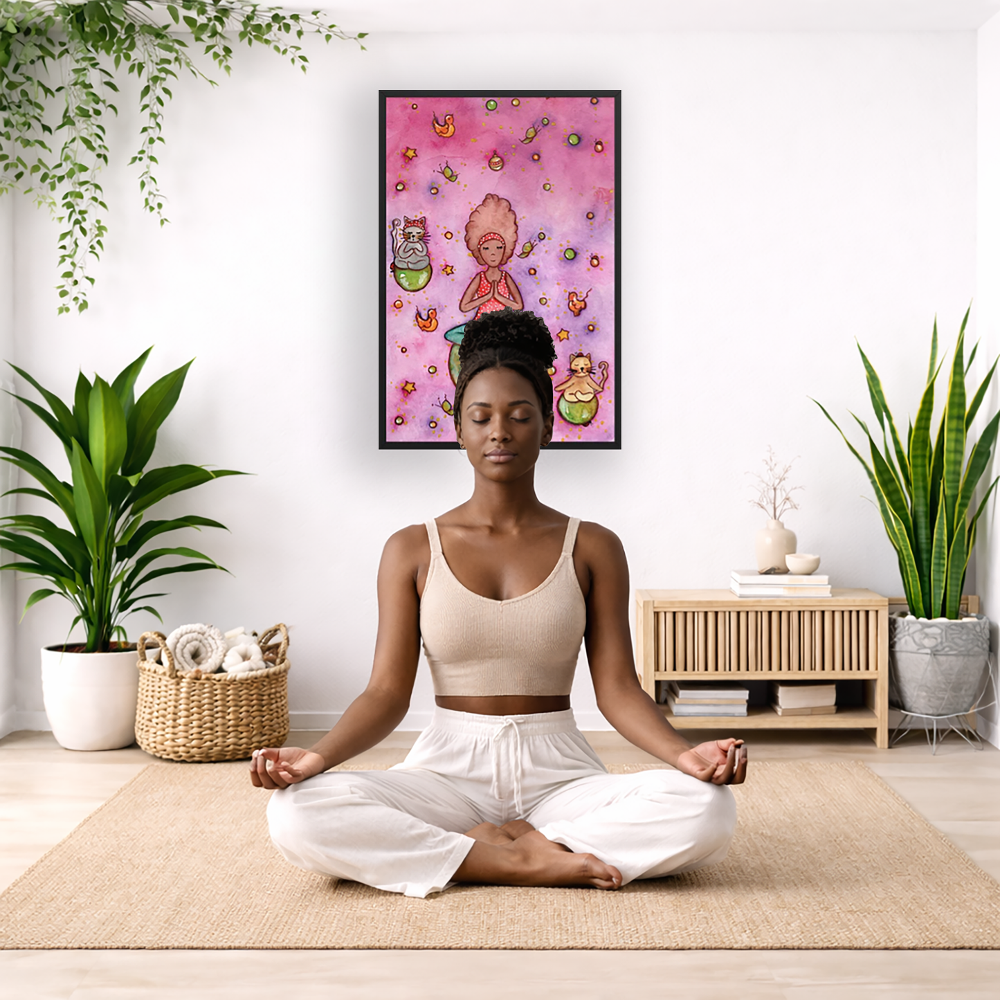 Poster of a woman and her cats meditating atop their own personal worlds with a pink background. The poster is framed and is in the center of the living room wall. There is a woman meditating facing away from the wall. Behind her is a coffee table with incense and a Buddha statue. There are potted plants on the right and left side of the background.
