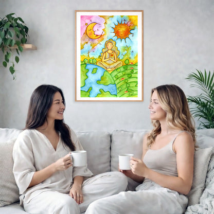 Poster of a woman meditating beneath the sun and moon cosmic design.  The poster is framed and is in the center of the living room wall. Two female friends are having tea, grapes and cookies on a coffee table in front of the poster. On the left there is a green potted plant and to the right there is a hanging lamp.
