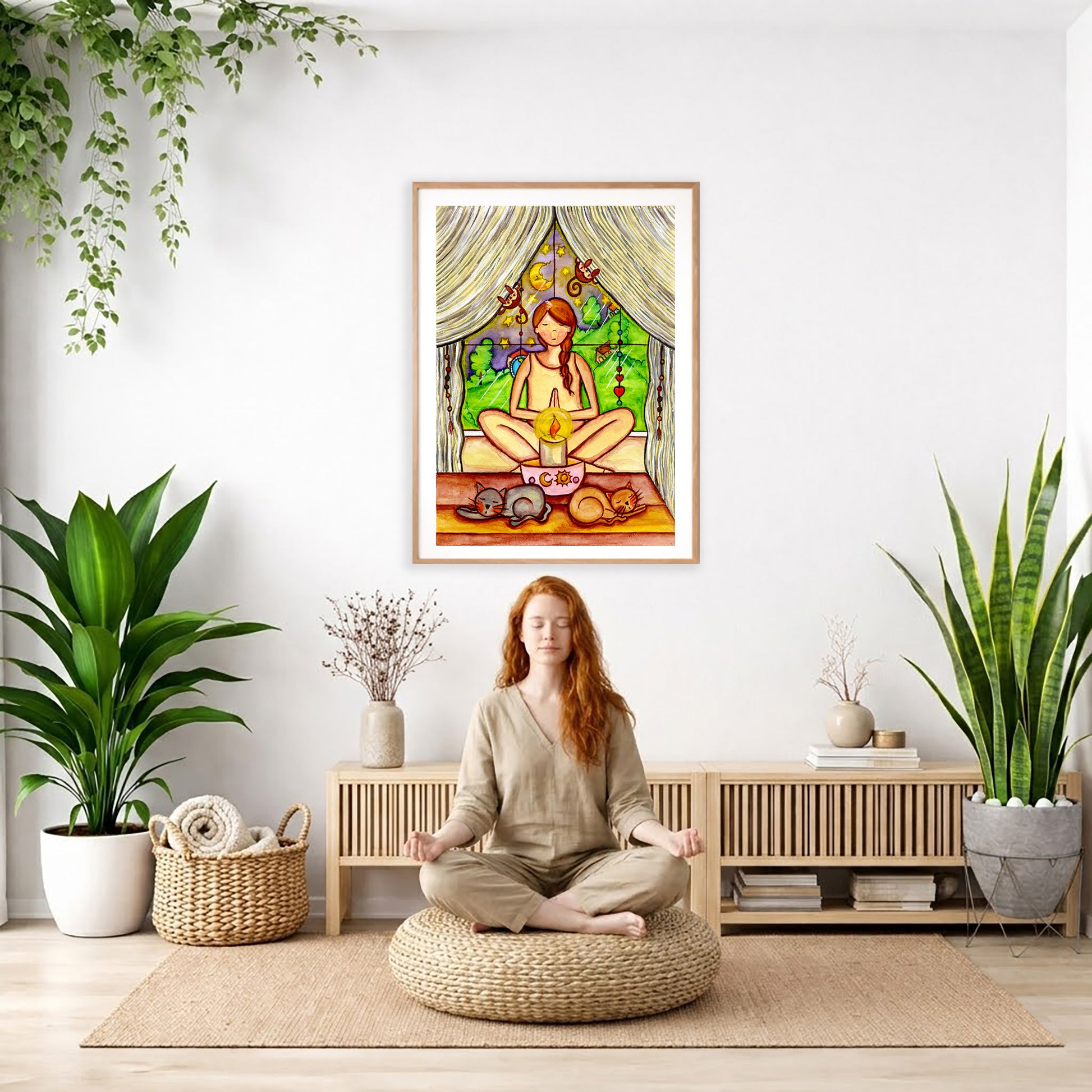 Candlelight trataka meditation design on mindfulness poster. The poster is framed and is in the center of the living room wall. There is a woman meditating facing away from the wall. Behind her is a coffee table with incense and a Buddha statue. There are potted plants on the right and left side of the background.
