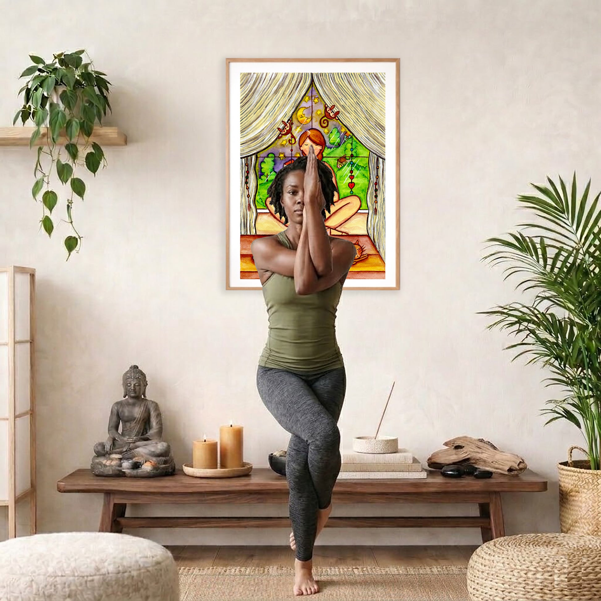 Candlelight trataka meditation design on mindfulness poster. The poster is framed and is in the center of the living room wall. A woman is doing a sitting forward bend on her yoga mat. There is a coffee table below the poster with burning candles, incense, a Buddha statue and a big piece of driftwood.
