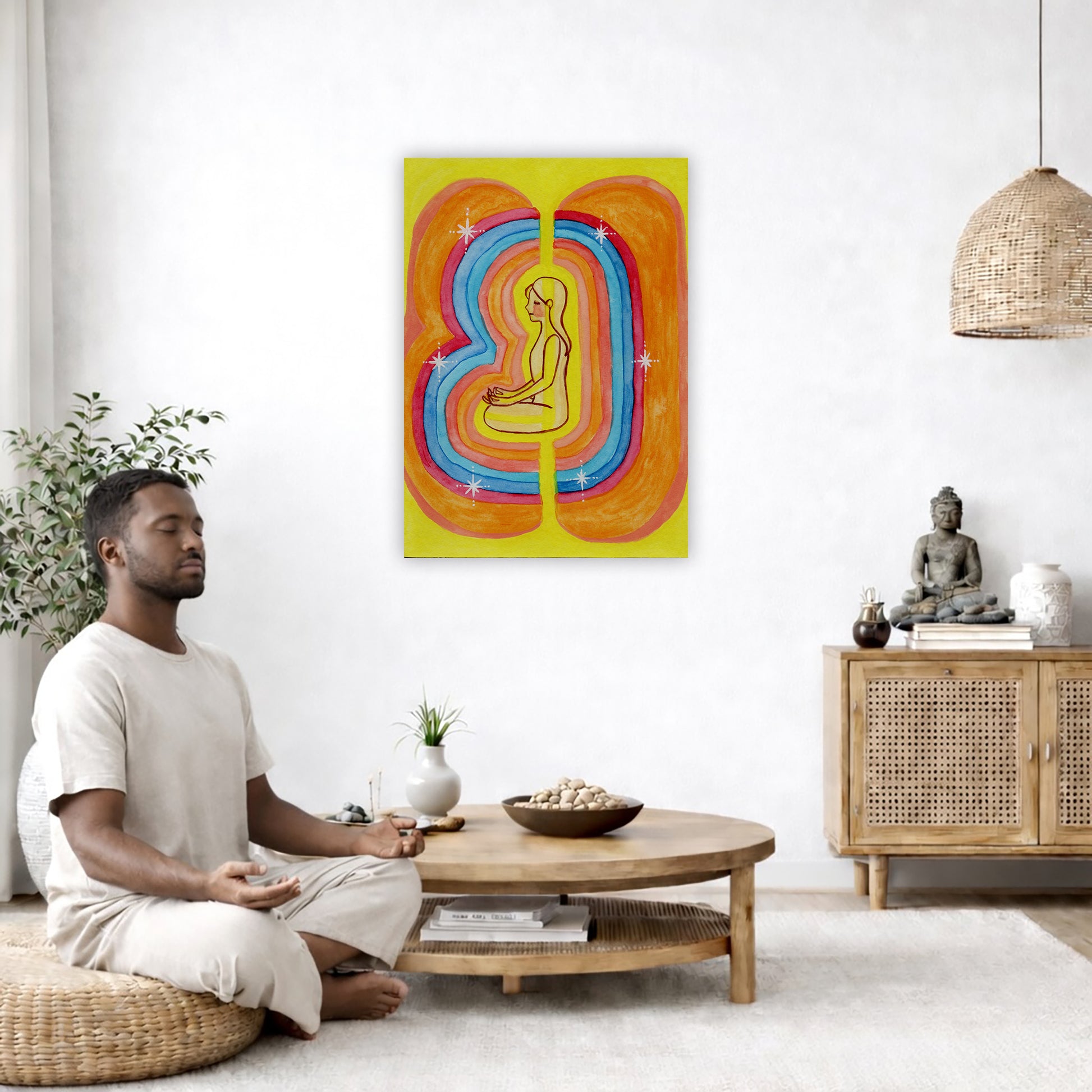 Rainbow aura energy field portrait on mindfulness canvas poster.  The poster is framed and is in the center of the living room wall. A man is on a chair on the left side of his living room meditating. On the right side is a cabinet with a Buddha statue on it.

