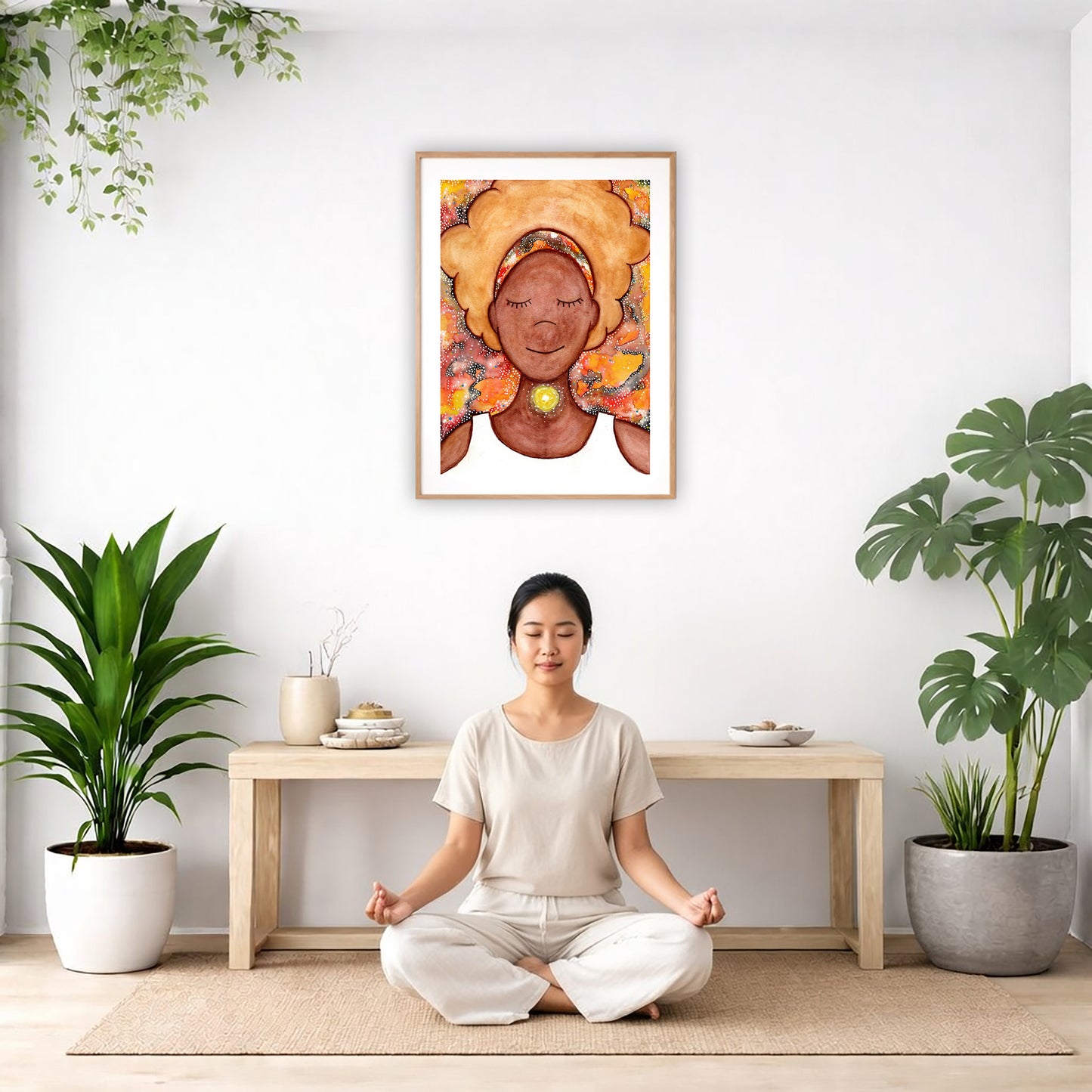 Poster of a woman's throat chakra energy glowing.  The poster is in the center of the living room wall. There is a woman meditating facing away from the wall. Behind her is a coffee table with incense and a Buddha statue. There are potted plants on the right and left side of the background.
