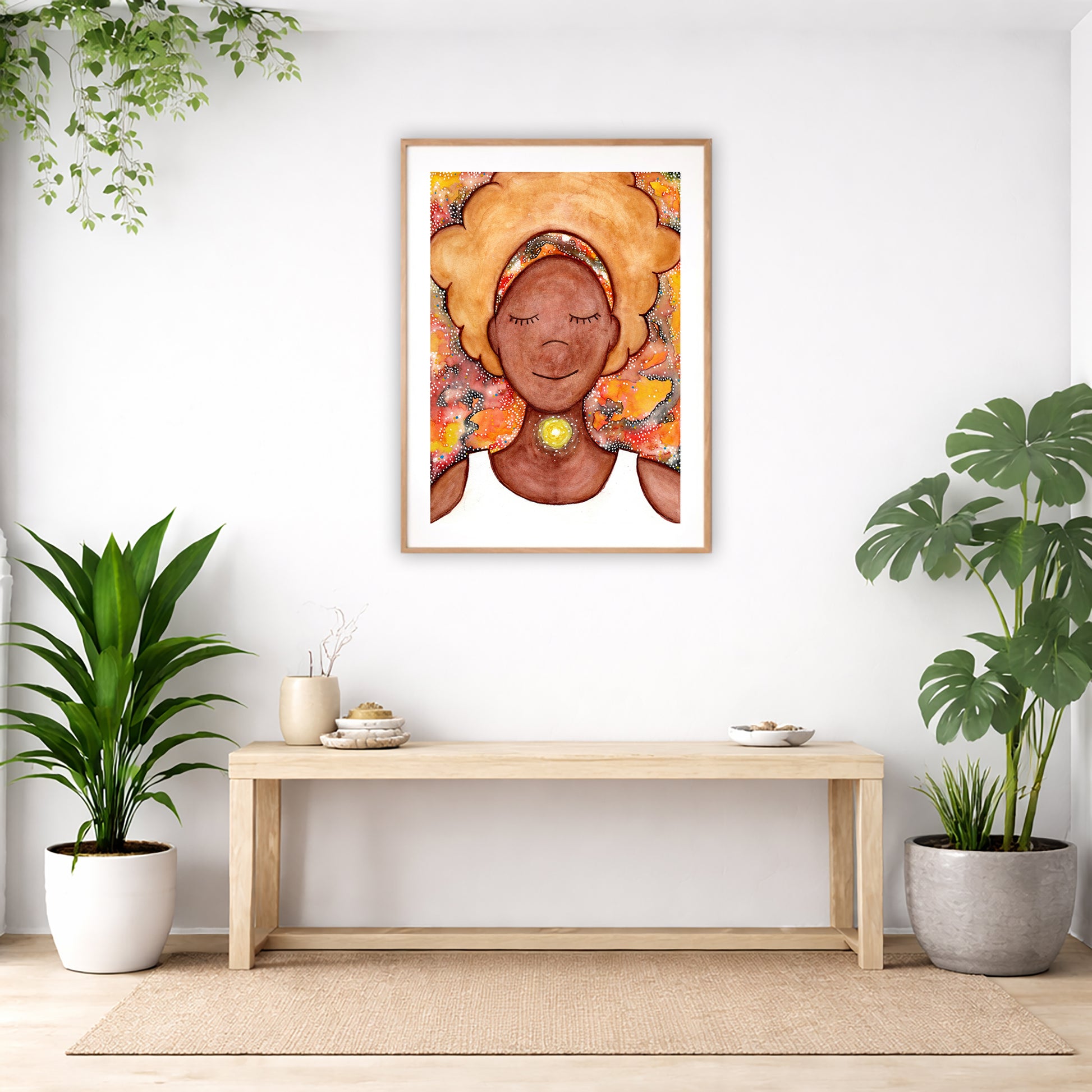 Poster of a woman's throat chakra energy glowing.  The poster is in the center of the living room wall. Below the poster is an empty bench. Below the bench is a variety of green potted plants including a few cactus.
