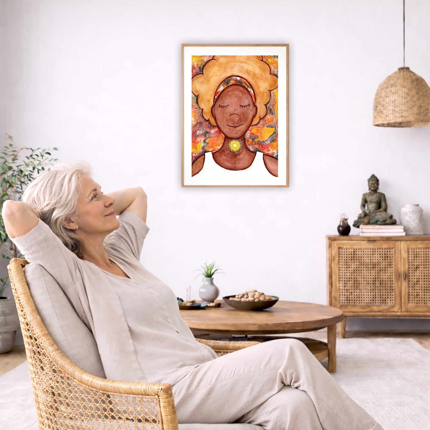 Poster of a woman's throat chakra energy glowing.  The poster is in the center of the living room wall. To the left a woman is relaxing in her chair with her hands behind her head. There is a small coffee table beside her with a bowl of walnuts, incense and a small green plant. On the right side of the room is a cabinet with a Buddha statue, books and an urn on it. To the left is a green floor plant.
