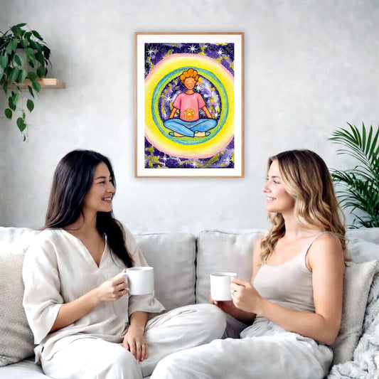 Poster of a young man meditating with his solar plexus glowing. Surrounding him is his colorful aura.  The poster is in the center of the living room wall. Two female friends are sitting on a white couch having tea. On the left and rights sides there is a green potted plant.