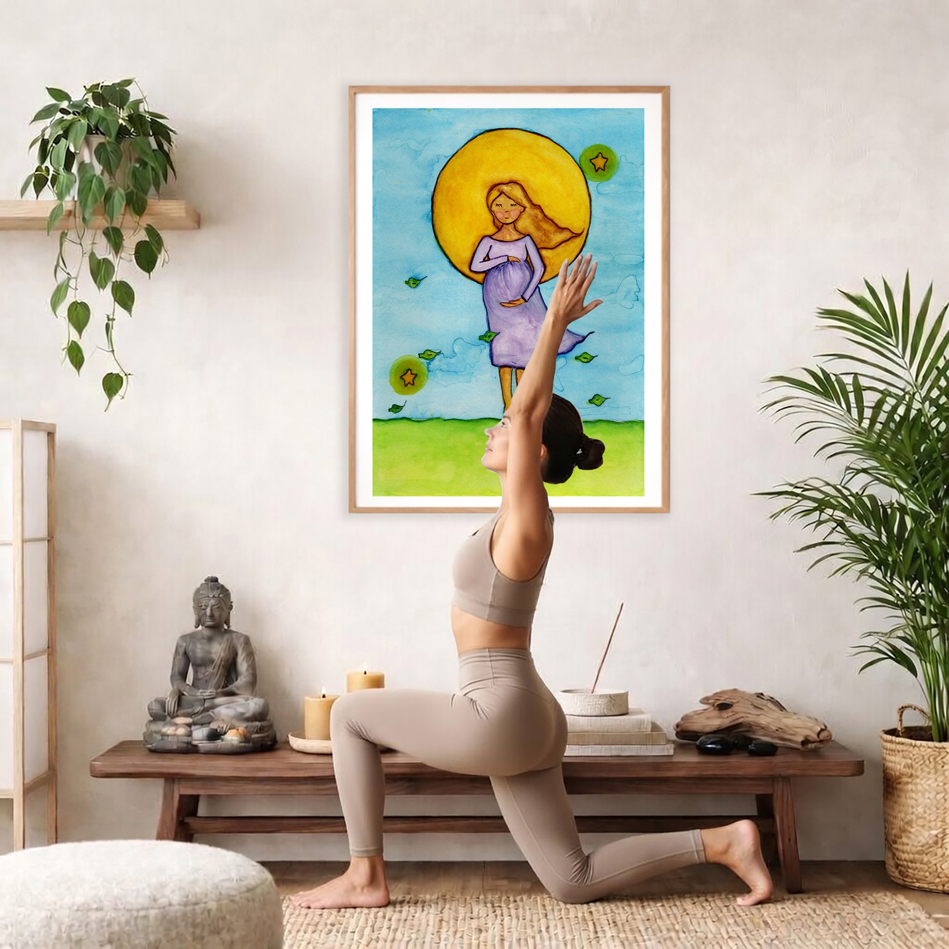 Woman standing in meditation under a glowing sun with blue sky background, calming watercolor spiritual illustration.  The poster is framed and is in the center of the living room wall. A woman is doing a sun salutation on her yoga mat. There is a coffee table below the poster with burning candles, incense, a Buddha statue and a big piece of driftwood.
