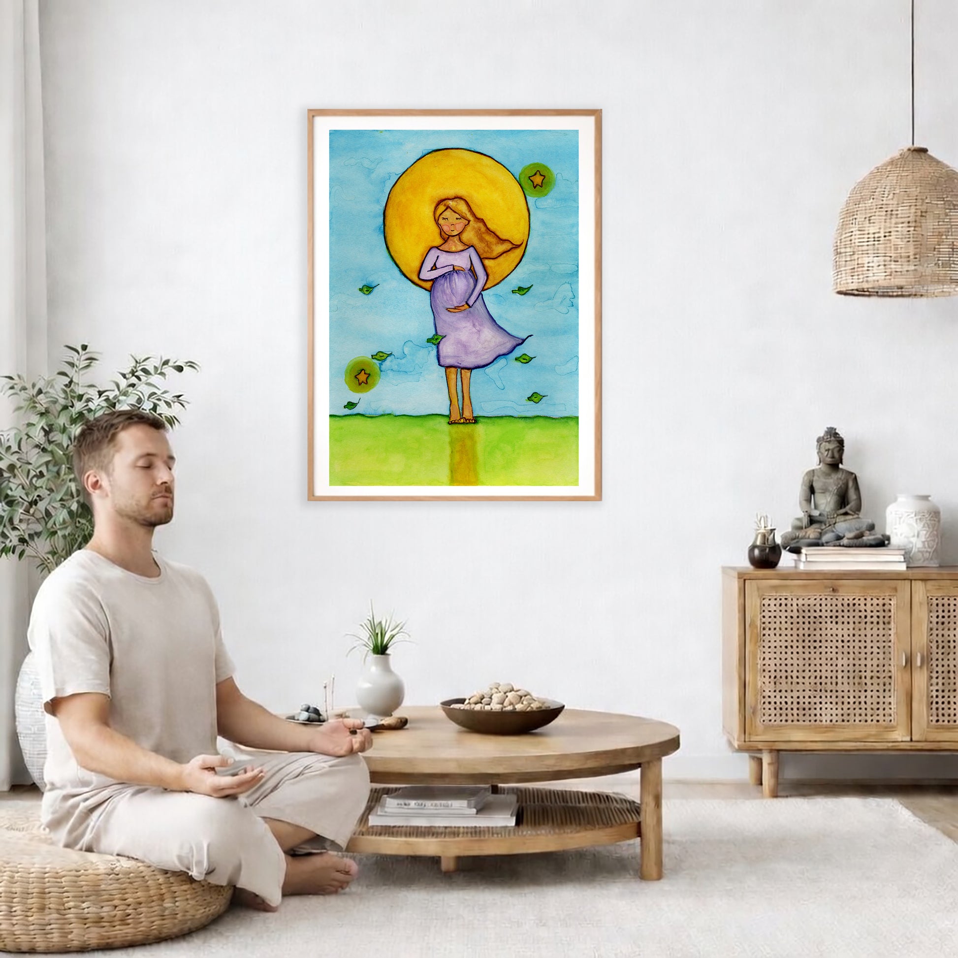 Woman standing in meditation under a glowing sun with blue sky background, calming watercolor spiritual illustration. The poster is framed and is in the center of the living room wall. A man is on a chair on the left side of his living room meditating. On the right side is a cabinet with a Buddha statue on it.
