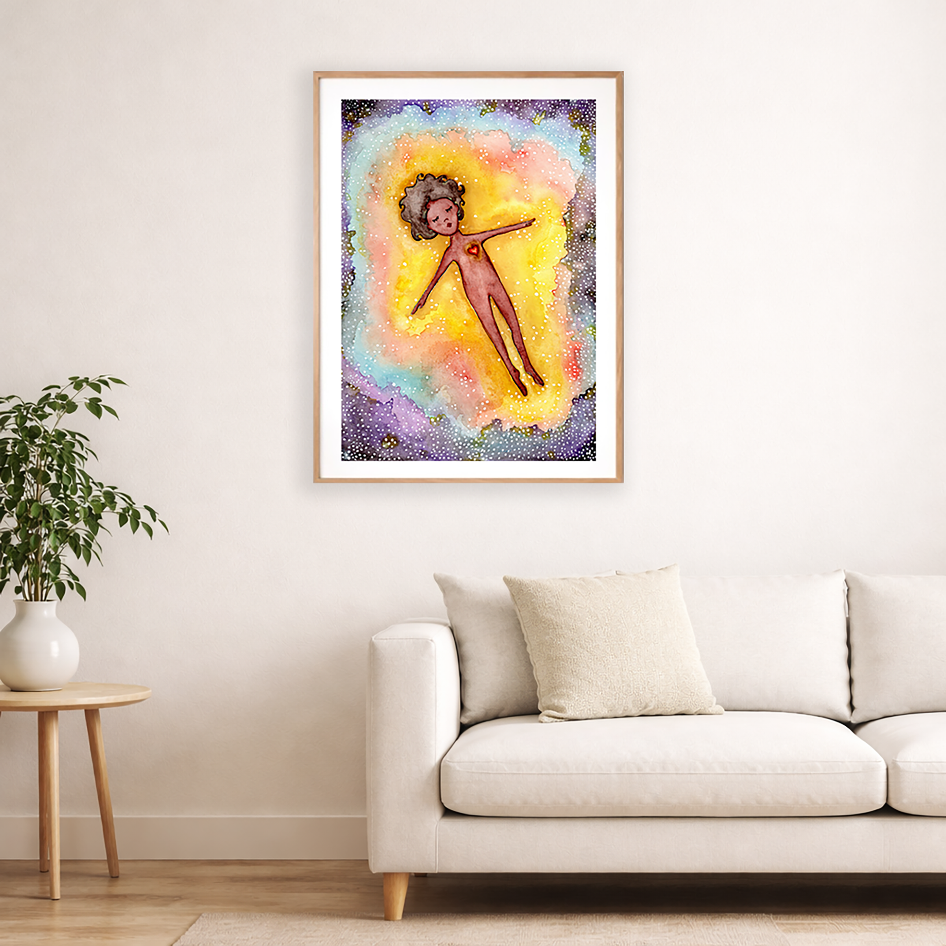 Full sized poster of an astral body relaxing in the space of another dimension. The poster is framed and is in the center of the living room wall. Below the poster is a white couch and a hardwood floor. To the bottom left there is a green potted plant on a small table.