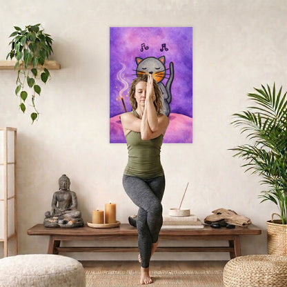 Poster of a gray cat chanting while sitting on a pink cloud. Whimsical spiritual meditation illustration.  A woman is doing the yoga Eagle Pose in front of the poster. There is a coffee table behind her with a Buddha statue, incense and candles. A green potted plant is on each side of the image.