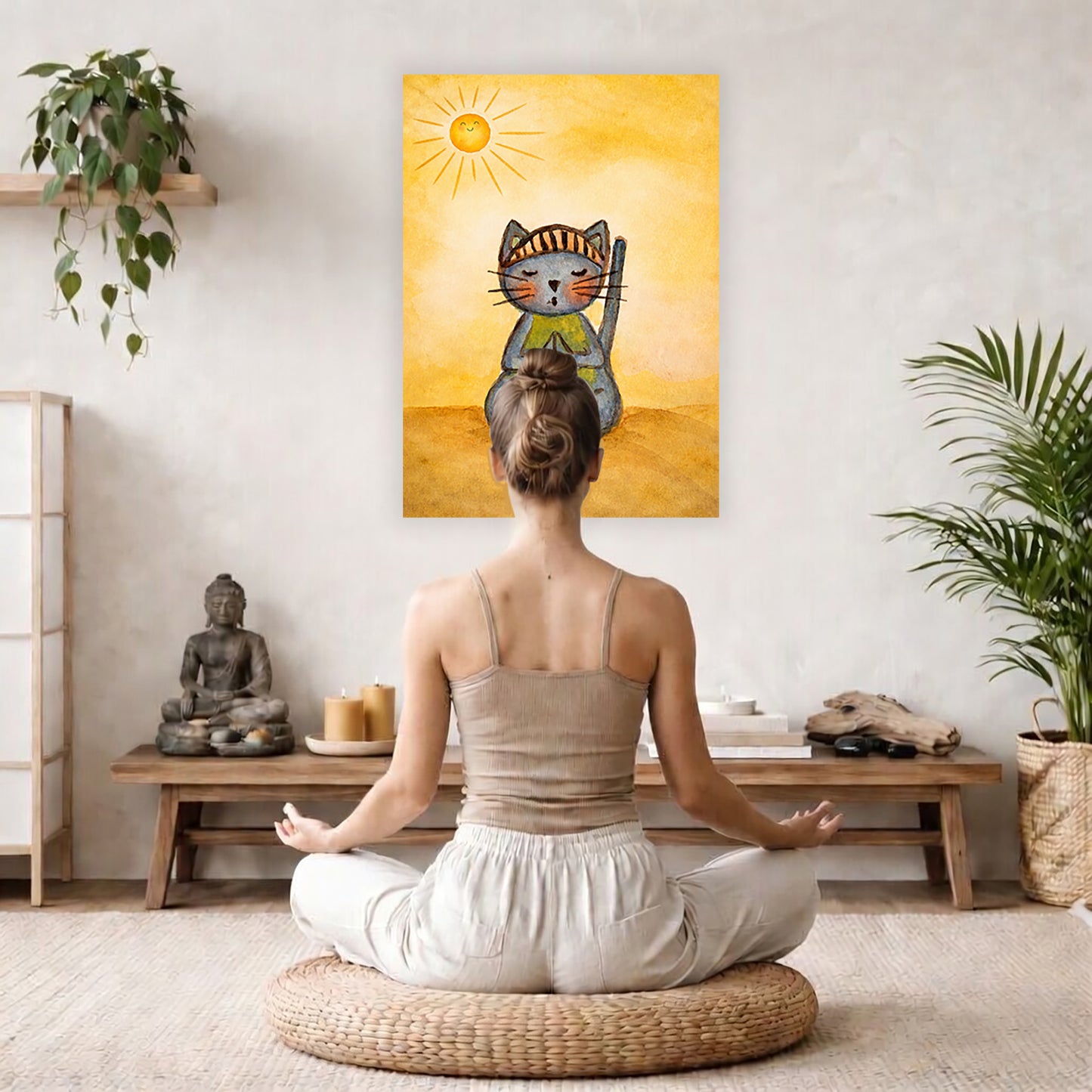 Poster of a gray cat meditating peacefully on a sunny day with warm light and calm surroundings.  The poster hanging on a living room wall. A woman is mediating facing the poster. There is a coffee table in front of her with burning candles and a Buddha statue. There are green potted plants on each side of the room.

