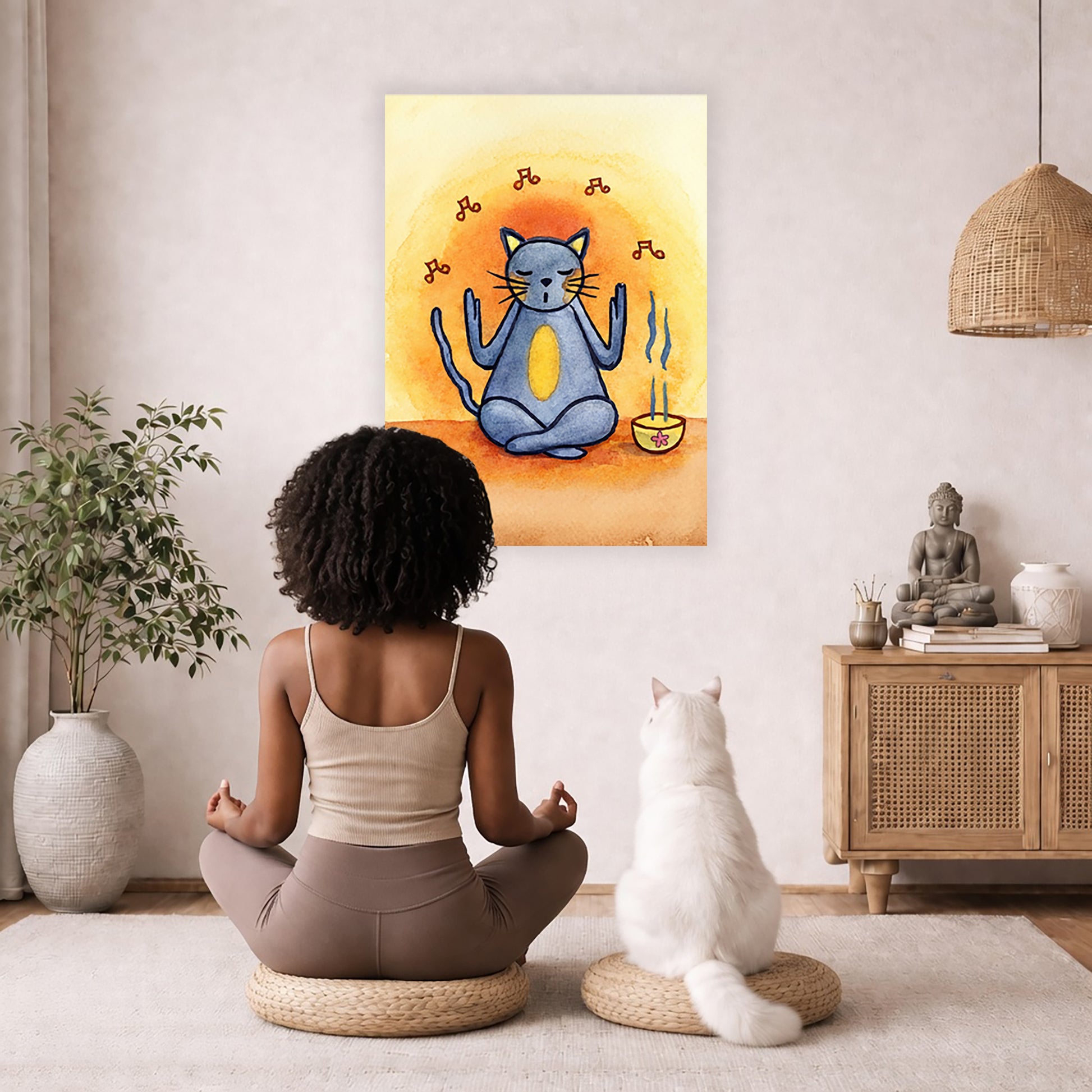 Poster of a gray cat chanting in meditation with incense smoke rising beside it.  A cat and woman are sitting on a wicker pillow meditating facing the poster. There is a floor plant on in the left corner. On the right side is a cabinet with a Buddha statue on top, burning incense and a few books.
