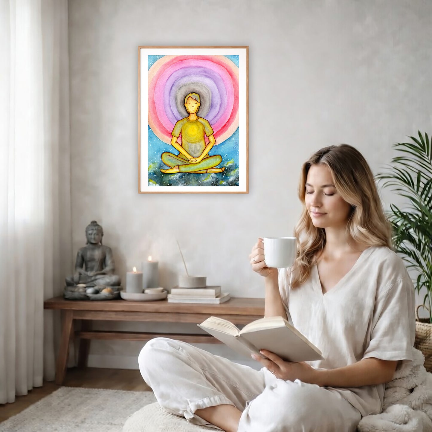 Poster of a young man's heart chakra glowing and aura energy flowing around him.  The poster is on the back wall in the living room. There is a coffee table below the poster with burning candles and a big piece of driftwood. A woman is sitting in a wicker chair on the right side of the poster with a cup of tea reading a book. There is a potted green plant behind her.
