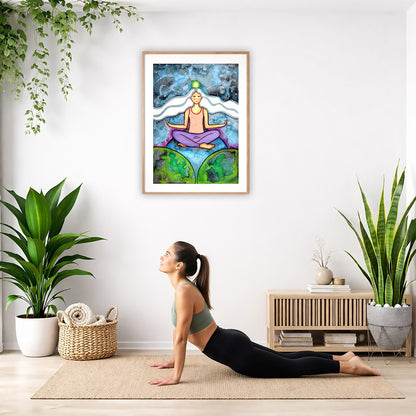 Poster of a woman meditating on three worlds with her crown chakra glowing.  The poster is hanging on the wall. A woman on her yoga mat is doing the cobra pose in front of the poster. There is a potted plant and a hanging plant on the left side. A padded bench with material draped over it is behind her. On the right side are two potted plants.
