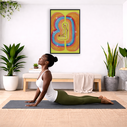 Rainbow aura energy field portrait on mindfulness framed poster.  The poster is framed and is in the center of the living room wall. Below the poster a woman is doing the yoga posture downward facing dog on a wicker yoga mat.
