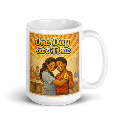 Retro 70s-style One Day at a Time sobriety illustration featuring two women hugging during a recovery celebration while holding a one-year sobriety medallion beneath orange and gold vintage sunburst rays.