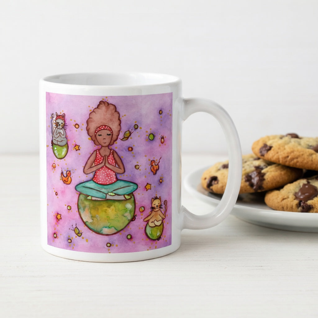 Woman and multiple cats meditating while sitting on the world, symbolizing unity, peace and global mindfulness, unique spiritual mug design.  Beside the mug is a plate of cookies.