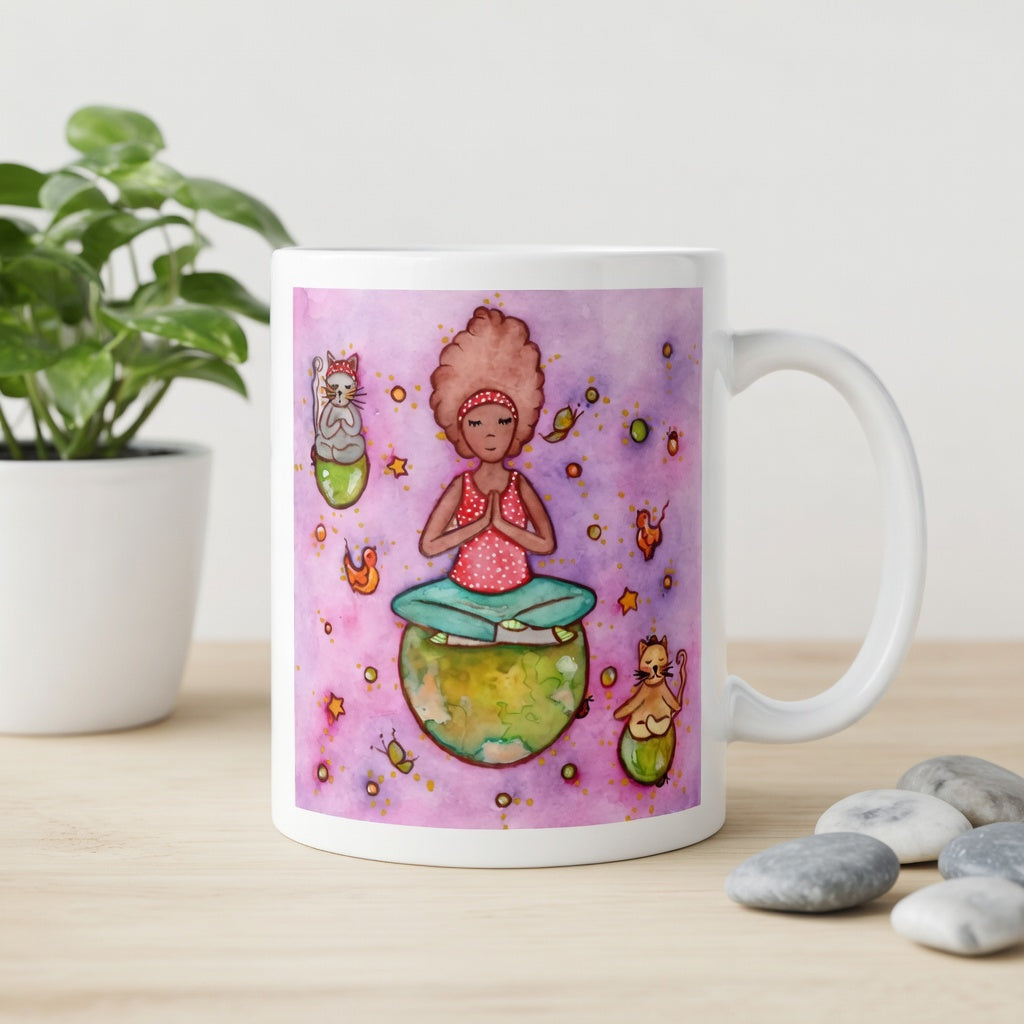 Woman and multiple cats meditating while sitting on the world, symbolizing unity, peace and global mindfulness, unique spiritual mug design. The mug is on a counter. Beside the mug are meditation stones. Behind the mug is a green potted plant.