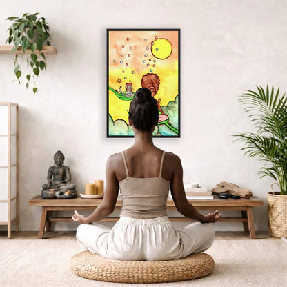 Poster of a woman and her cat sitting on leaves meditating with a yellow sunny joyful background. The poster is framed hanging on a living room wall. A woman is mediating facing the poster. There is a coffee table in front of her with burning candles and a Buddha statue. There are green potted plants on each side of the room.
