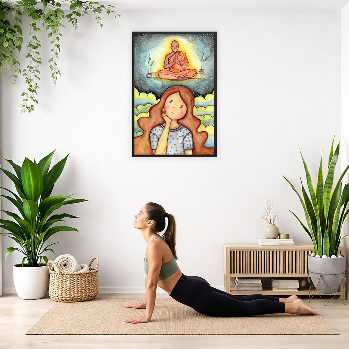 Framed print of a young woman wondering about taking up meditation as a Buddhist monk hovers above her on a higher level. The print is by Brazilian illustrator Thaís Suizo created for the LET'S MEDITATE series.  The poster is hanging on the wall. A woman on her yoga mat is doing the cobra pose in front of the poster. There is a potted plant and a hanging plant on the left side. A padded bench with material draped over it is behind her. On the right side are two potted plants.