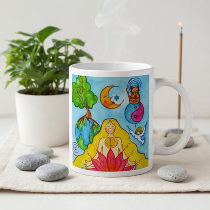 Woman sitting in meditation on a red lotus flower, symbolizing growth, strength and spiritual awakening, peaceful mindfulness artwork on a coffee mug.  The mug is on a cloth mat. Beside the mug are meditation stones. Behind the mug incense and candles are burning.