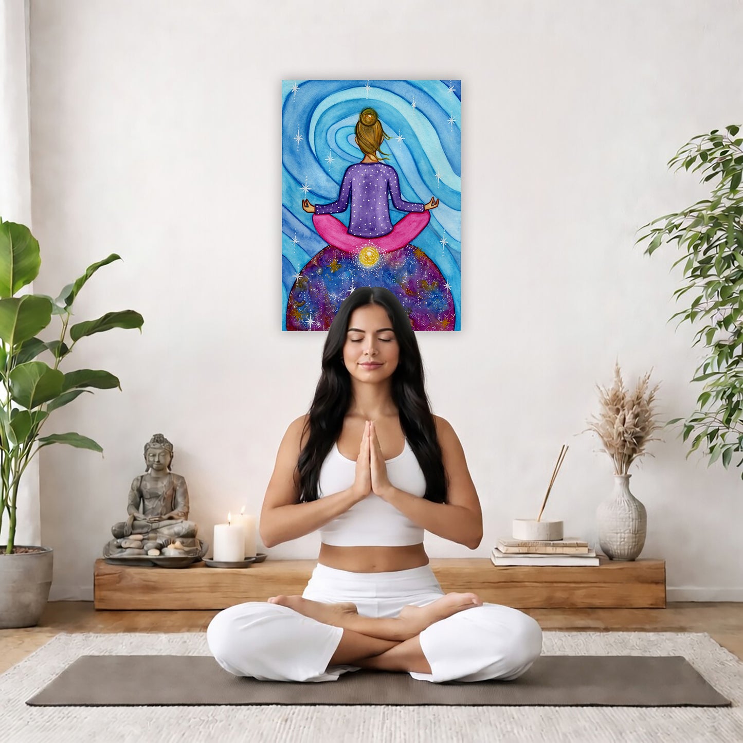 Canvas of a woman meditating with her root chakra glowing. This is a print of the original hand-painted watercolor by Brazilian artist Thaís Suizo for the LET'S MEDITATE SERIES of mediation guides.  The poster is in the center of the living room wall. There is a woman meditating facing away from the wall. Behind her is a coffee table with incense and a Buddha statue. There are potted plants on the right and left side of the background.
