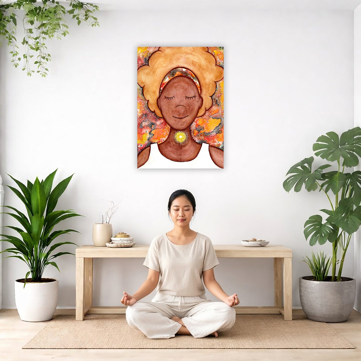 Woman's throat chakra energy glowing canvas. This is a print of the original hand-painted watercolor by Brazilian artist Thaís Suizo from the LET'S MEDITATE SERIES of mediation guides. The poster is in the center of the living room wall. There is a woman meditating facing away from the wall. Behind her is a coffee table with incense and a Buddha statue. There are potted plants on the right and left side of the background.
