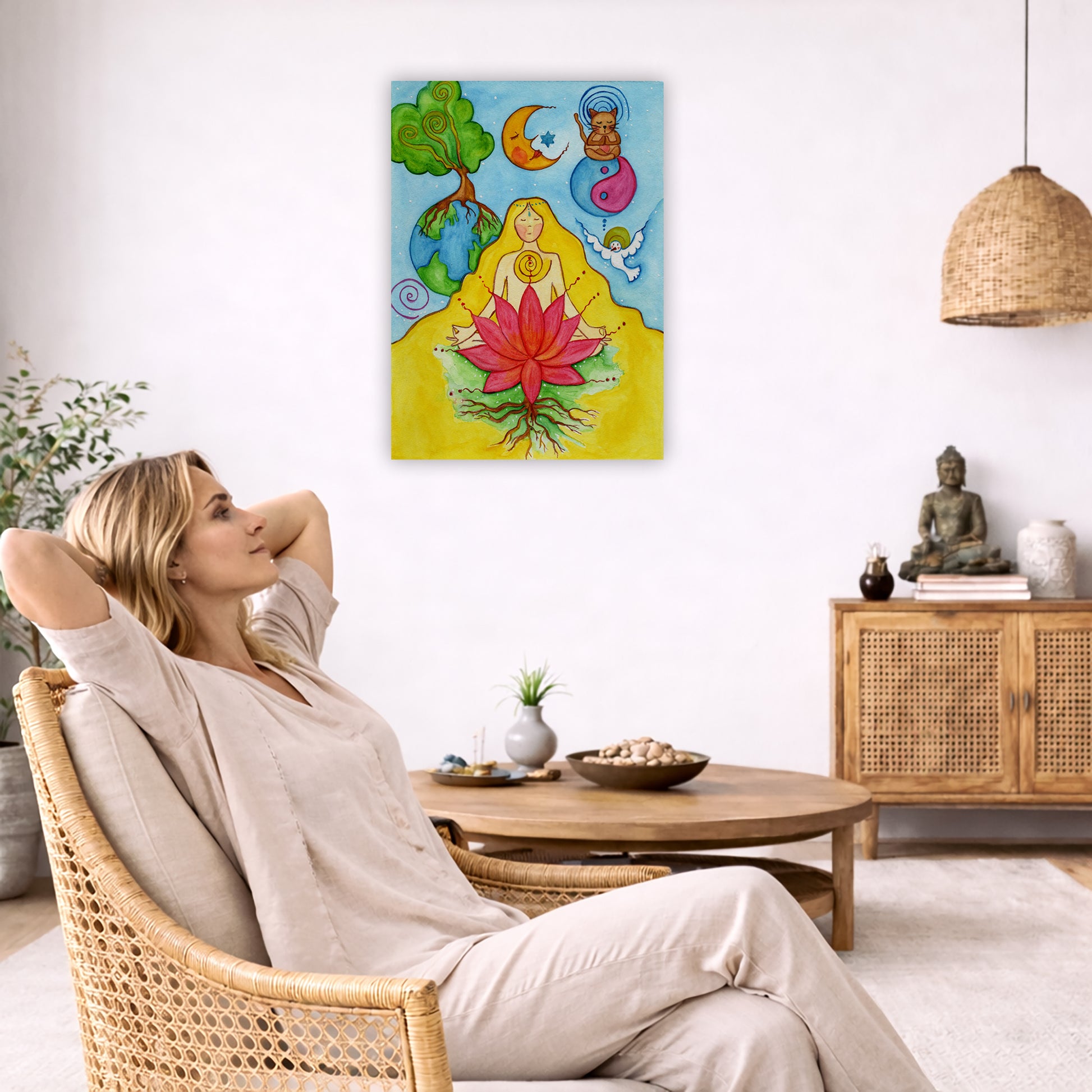A woman with a glowing heart chakra is meditating on top of a red lotus flower.  This is a canvas print of the original hand-painted watercolor by Brazilian artist Thaís Suizo for the LET'S MEDITATE SERIES of mediation guides. The poster is in the center of the living room wall. To the left a woman is relaxing in her chair with her hands behind her head. There is a small coffee table beside her with a bowl of walnuts, incense and a small green plant. On the right side of the room is a cabinet with a Buddha 