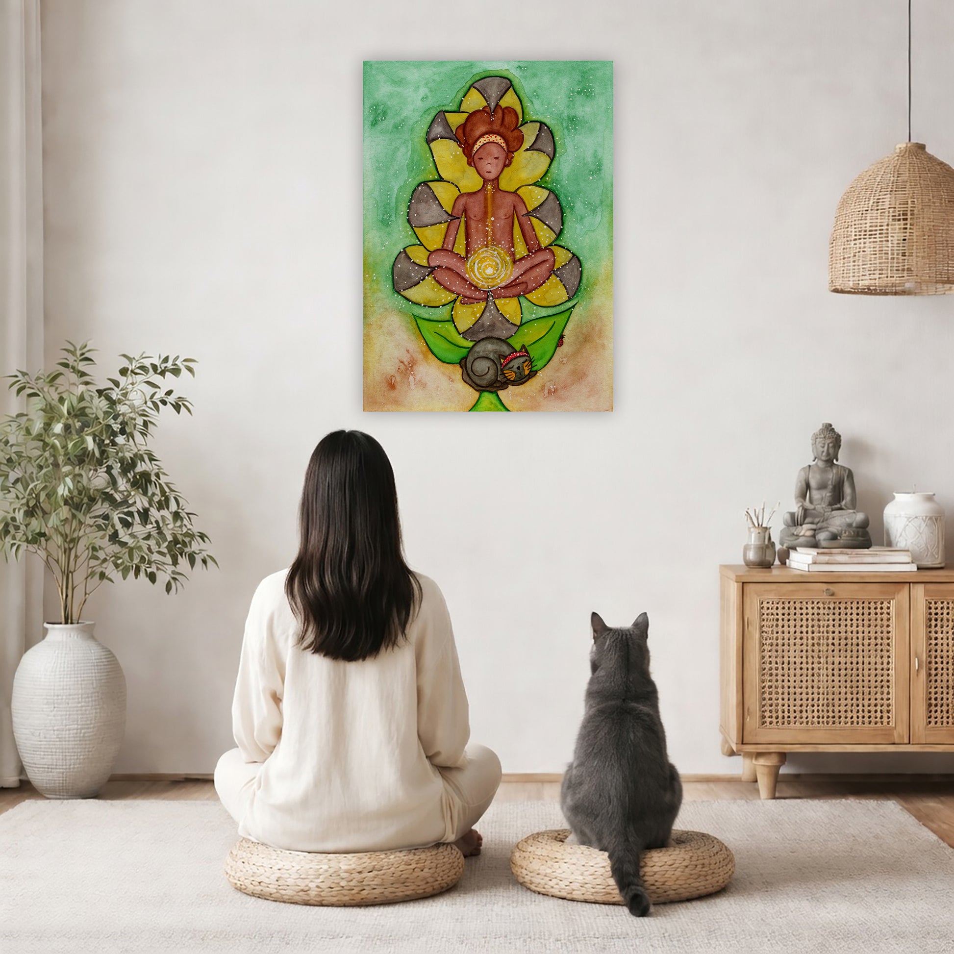 Canvas of a woman's sacral chakra glowing and the energy around her. This is a print of the original hand-painted watercolor by Brazilian artist Thaís Suizo for the LET'S MEDITATE SERIES of mediation guides.  The poster is in the center of the living room wall. A woman and a cat are staring up at the poster. There is a potted plant on the left side and a cabinet with a Buddha statue, books and incense on the right side.
 