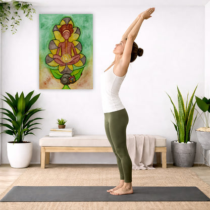 Canvas of a woman's sacral chakra glowing and the energy around her. This is a print of the original hand-painted watercolor by Brazilian artist Thaís Suizo for the LET'S MEDITATE SERIES of mediation guides.  The poster is in the center of the living room wall. A woman is doing a sun salutation on her yoga mat. There is a coffee table below the poster with burning candles, incense, a Buddha statue and a big piece of driftwood.
