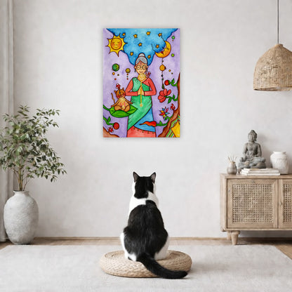 Throat chakra canvas print of a woman and her cat meditating under the sun and the moon.  The poster is in the center of the living room wall. A black and white cat is staring at the poster. There is a potted plant on the left side and a cabinet with a Buddha statue on it on the right side. 
