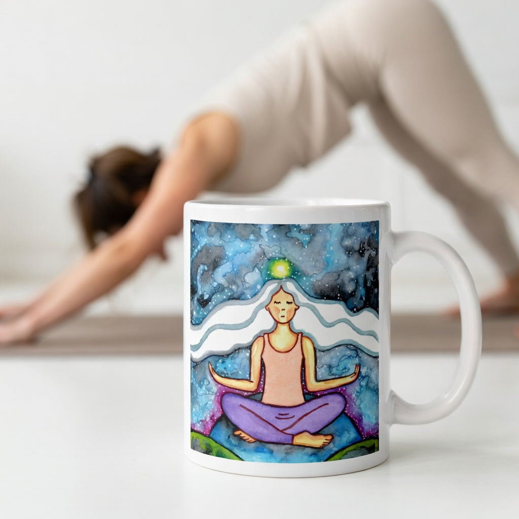 Meditating figure with glowing crown chakra at top of head, symbolizing higher consciousness and spiritual connection, chakra artwork featured on a mindfulness mug.  The mug is in front of a woman doing the yoga posture downward facing dog.