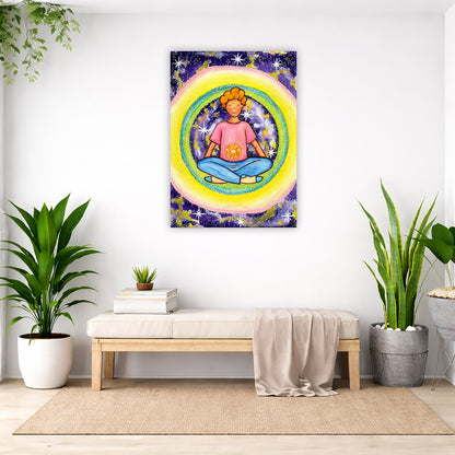 Young man meditating with his solar plexus glowing canvas. Surrounding him is his colorful aura. This is a print of the original hand-painted watercolor by artist Thaís Suizo for the LET'S MEDITATE SERIES of mediation guides. The poster is in the center of the living room wall. Below the poster is a padded bench. On the bench is a pile of books and a small green potted plant. There is a silk sheet draped over the bench. There is a green hanging plant and floor plant on the left. There are two floor plants.