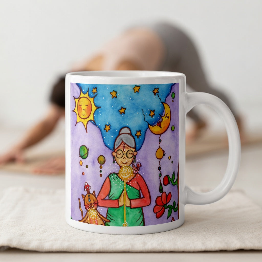 Woman and her cat meditating under sun and moon, peaceful scene representing harmony, balance and connection, spiritual coffee mug design.  The mug is in front of a woman doing the yoga posture downward facing dog.