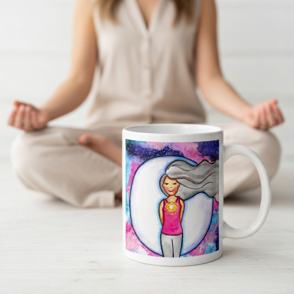 Meditating person with glowing heart chakra at center of chest, symbolizing love, compassion and emotional balance, spiritual design on a mindfulness coffee mug. A woman is meditating in the background.