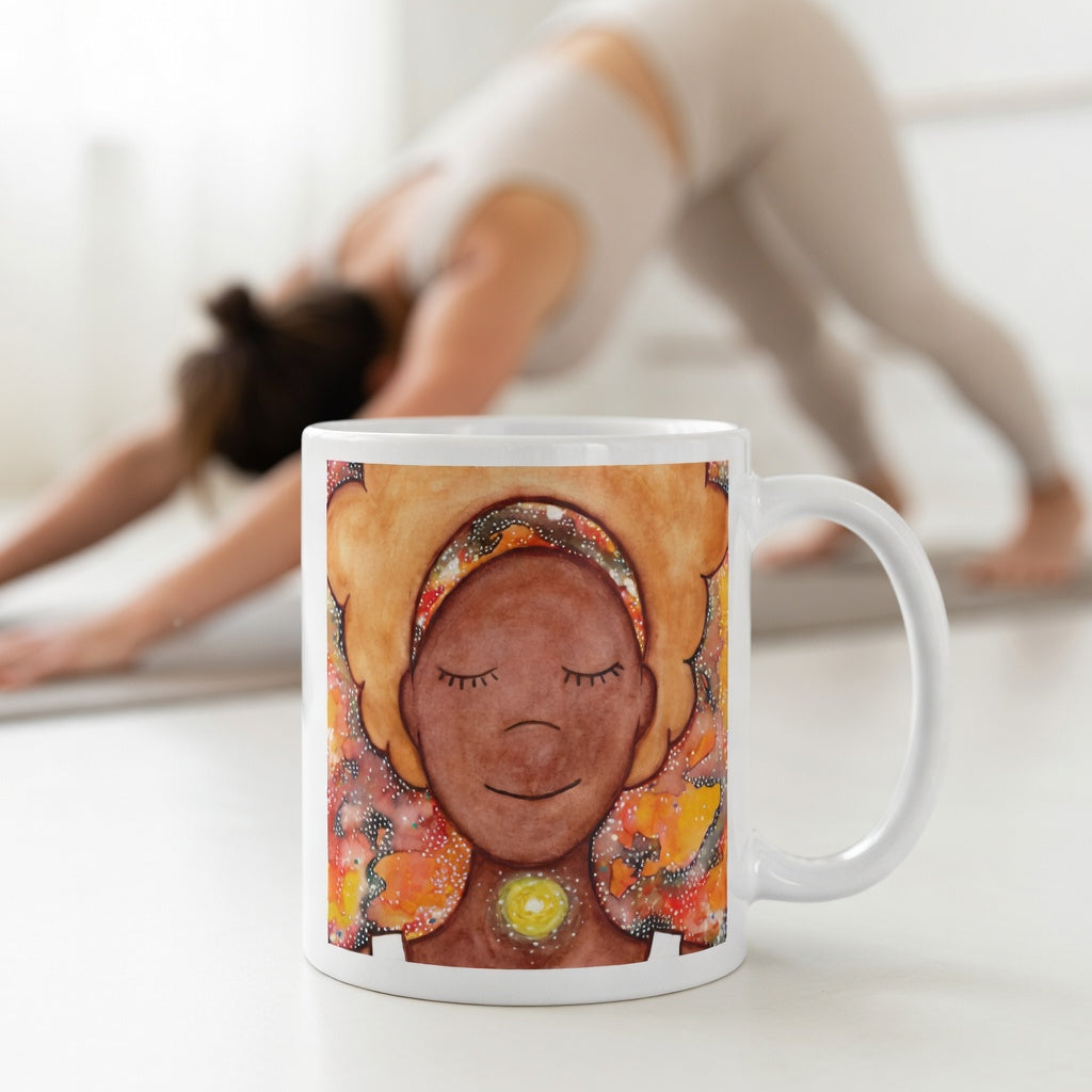Meditating figure with glowing throat chakra, symbolizing communication, truth and self-expression, spiritual mindfulness artwork on a coffee mug.  The mug is in front of a woman doing the yoga posture downward facing dog.