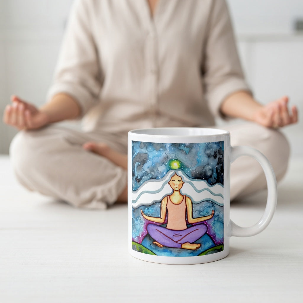 Meditating figure with glowing crown chakra at top of head, symbolizing higher consciousness and spiritual connection, chakra artwork featured on a mindfulness mug. A woman is meditating in the background.